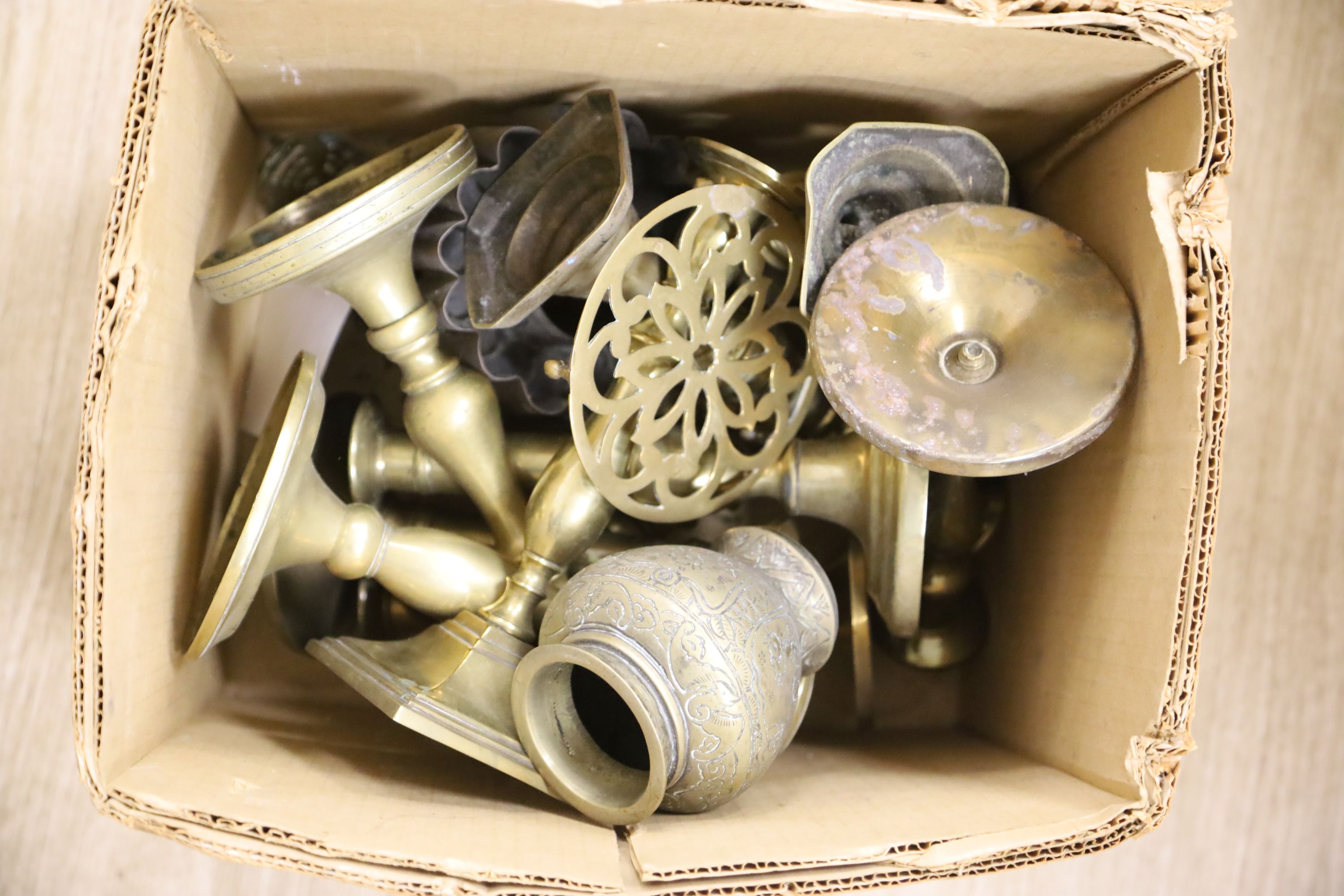 A quantity of mixed brassware including candlesticks, vases etc.